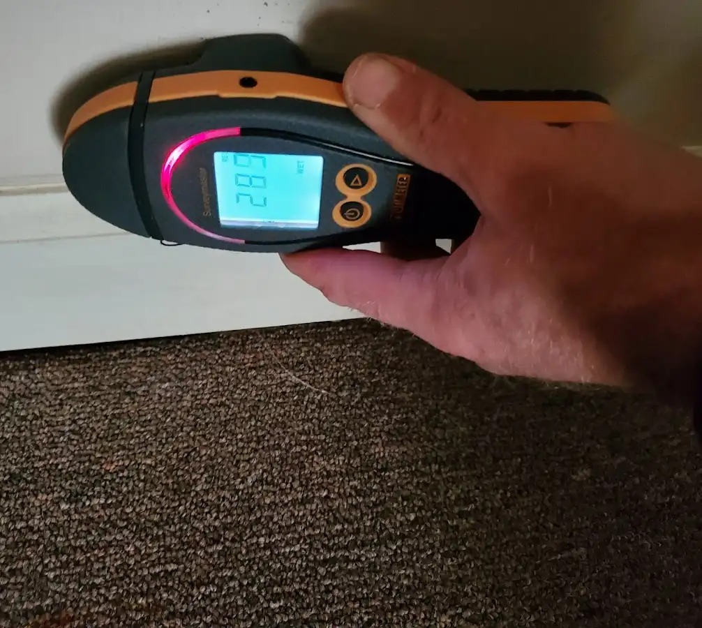 Moisture detection at baseboard during Storm Damage Restoration in Ashwaubenon